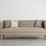 Three-Seater Sofa Upholstered With Beige Button-Back Details