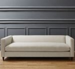 Off-White Three-Seater Sofa With Attached Armrests And Backrest