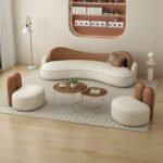 The Sofa Set Was Beige Velvet With Brown Accents.